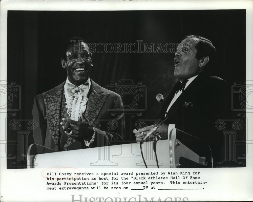 1977, Bill Cosby receives award from Alan King - mjp08540 - Historic Images