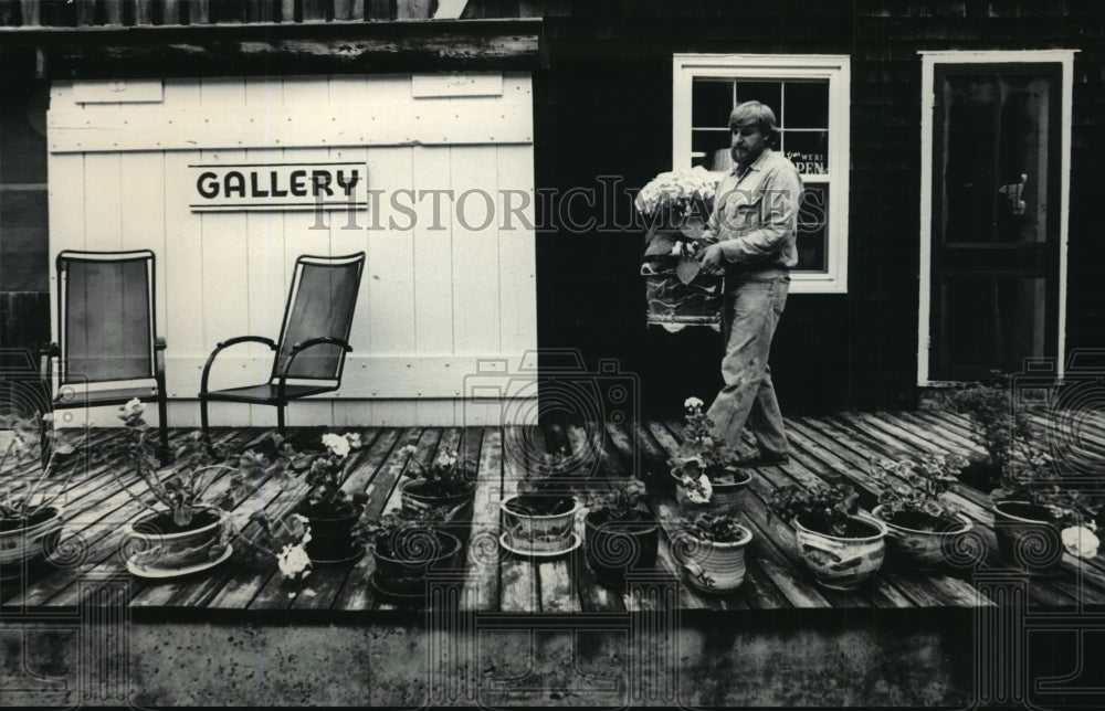 1984, John Dietrich, of Ellison Bay Pottery, at Door County gallery. - Historic Images