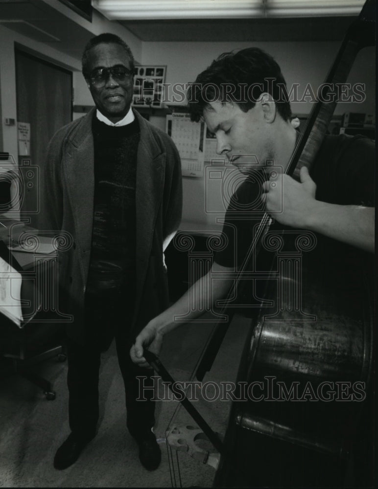 1993, Jazz bassist Richard Davis with music student Steve Kasprzak. - Historic Images