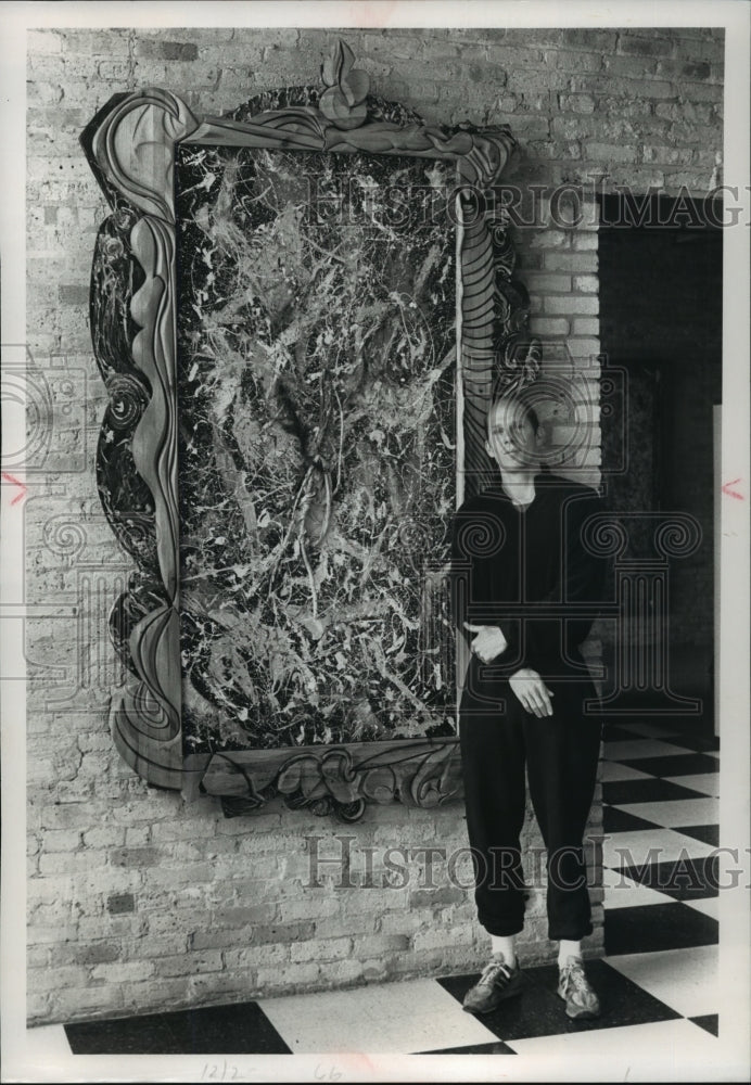 1989 Press Photo Track coach and artist Bruce Dorow shows paintings at MKE. - Historic Images