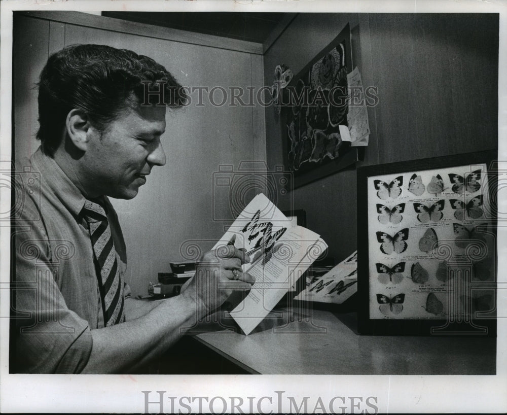 1971 Press Photo James A. Ebner with butterfly photographs in his new book. - Historic Images
