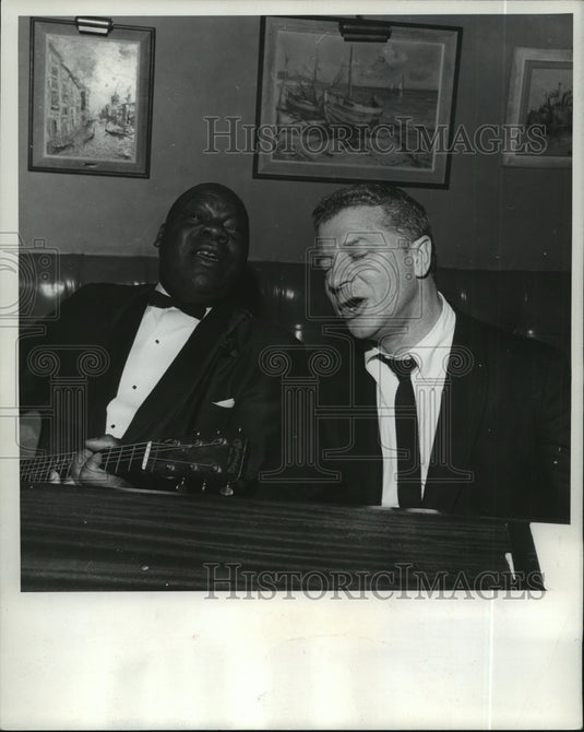 1964, David Susskind and Choo Anderson perform at a cabaret. - Historic Images