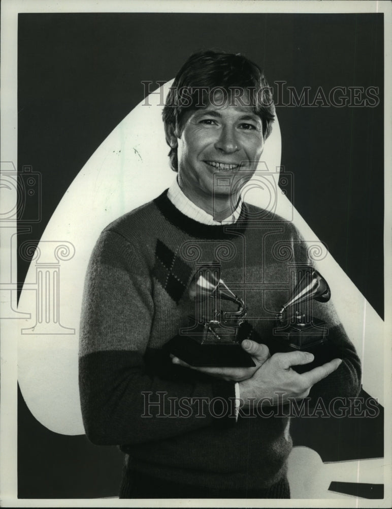 1984, John Denver hosts the 26th Annual Grammy Awards, on CBS. - Historic Images