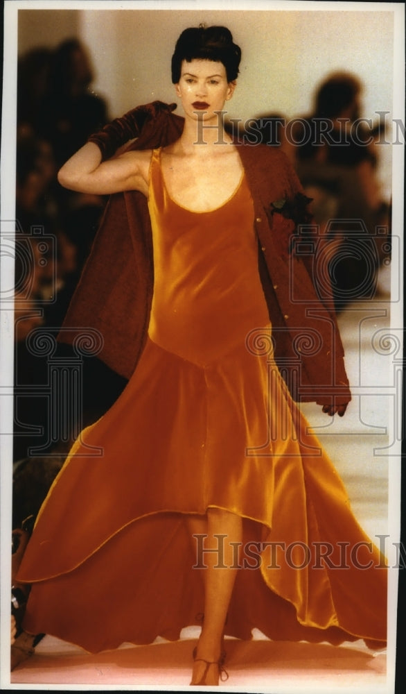 1993 Press Photo Fashion Model Wearing Apricot V-Cut Velvet Gown, Wool Coat - Historic Images