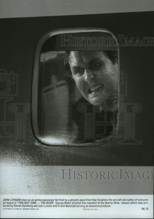 1983 Press Photo John Lithgow in a scene from Twilight Zone - The Movie. - Historic Images