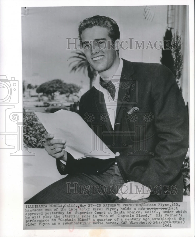 1961 Sean Flynn outside Santa Monica courthouse with new contract. - Historic Images