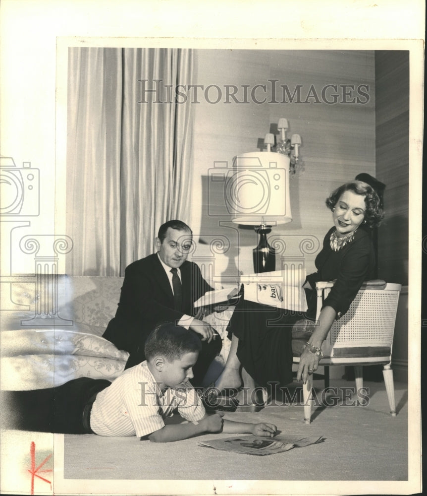 1957, Reading Circle-Arlene, Martin and Peter relax at home. - Historic Images