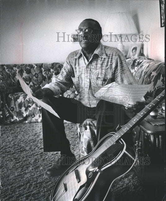 1977, Danny Frank, musician, with guitar and sheet music - mjp13713 - Historic Images