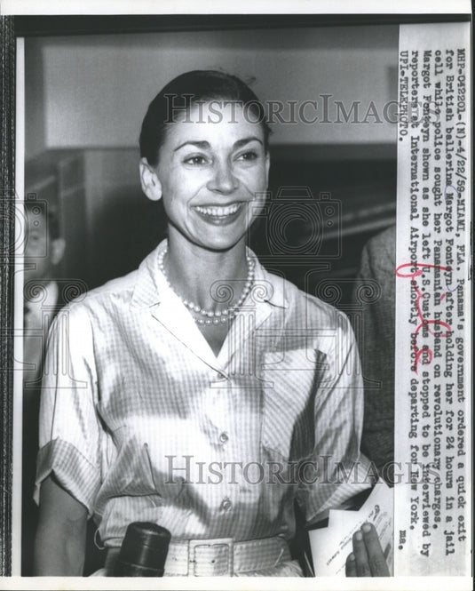 1959, British ballerina Margot Fonteyn speaks to reporters at airport - Historic Images