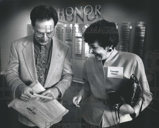 1991, Radio Personality Michael Feldman talks with Georgia Glaser, - Historic Images