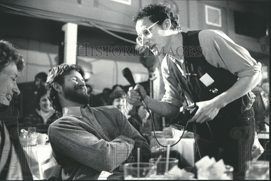 1985, Michael Feldman interviews couple in Madison, Wisconsin. - Historic Images
