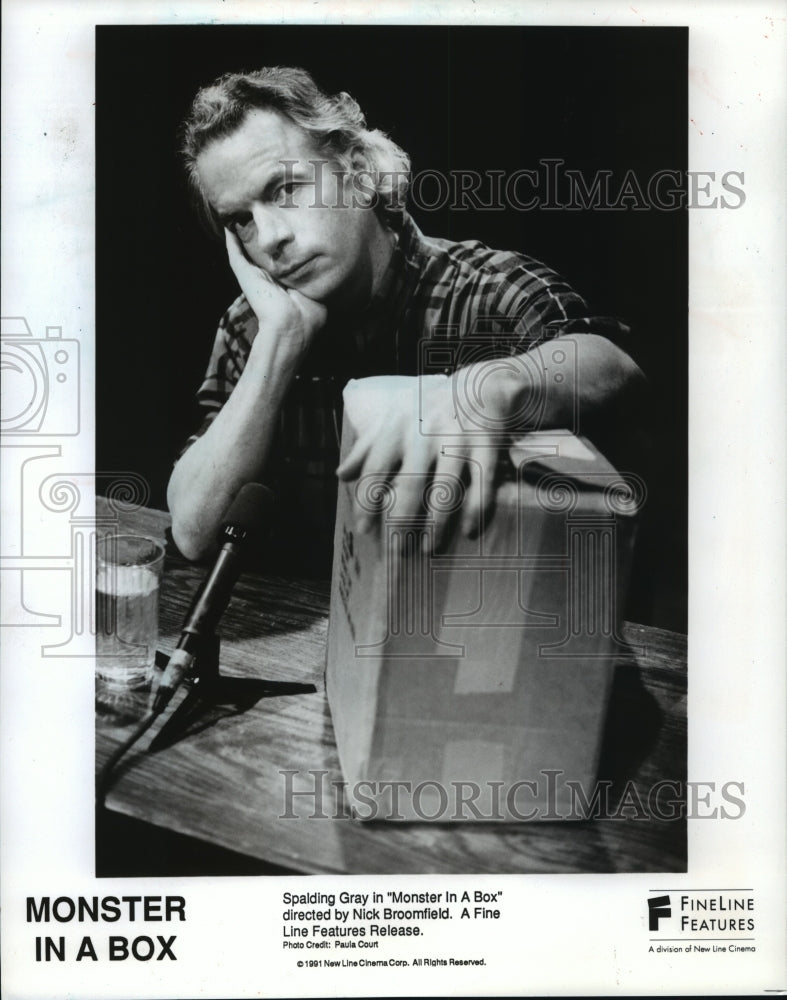 1992, Spalding Gray stars in "Monster in a Box" shown with the box - Historic Images