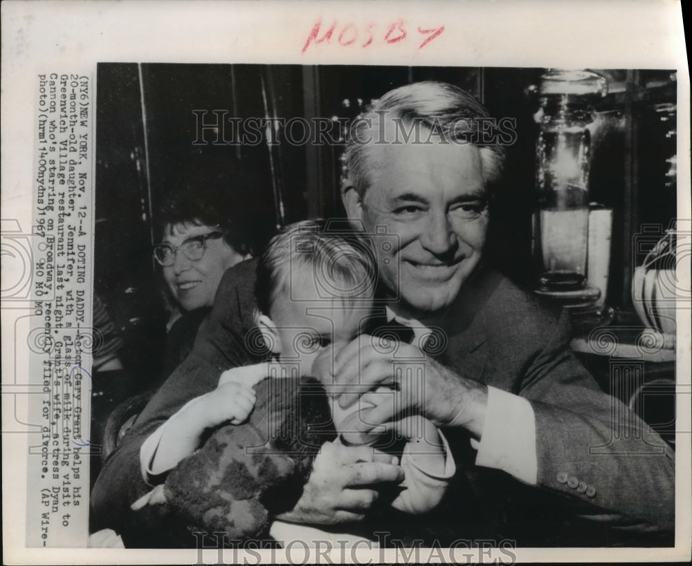 1967, Actor Cary Grant with baby daughter Jennifer - mjp15372 - Historic Images