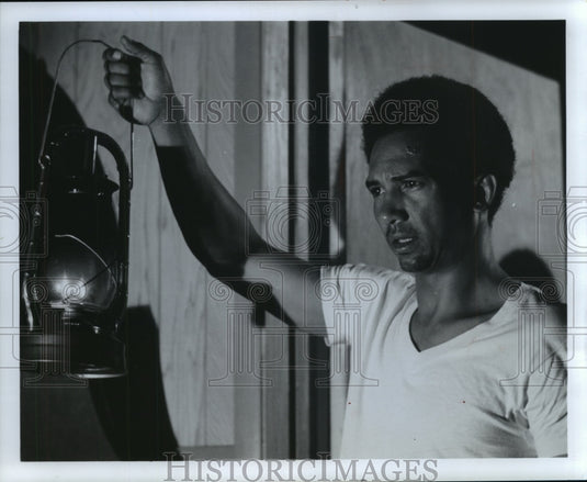 1975, Actor Al Freeman holds lantern - mjp15485 - Historic Images
