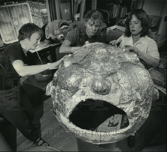 1985, Friends Mime Theater members work on puppet head. - mjp15511 - Historic Images