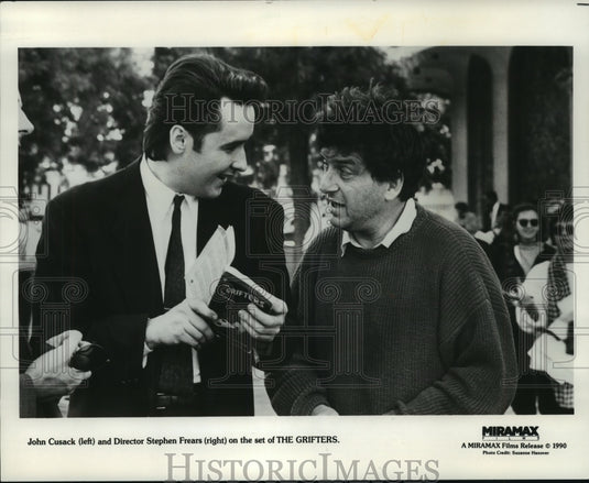 1991, John Cusack & Director Stephen Frears on the The Grifters set - Historic Images