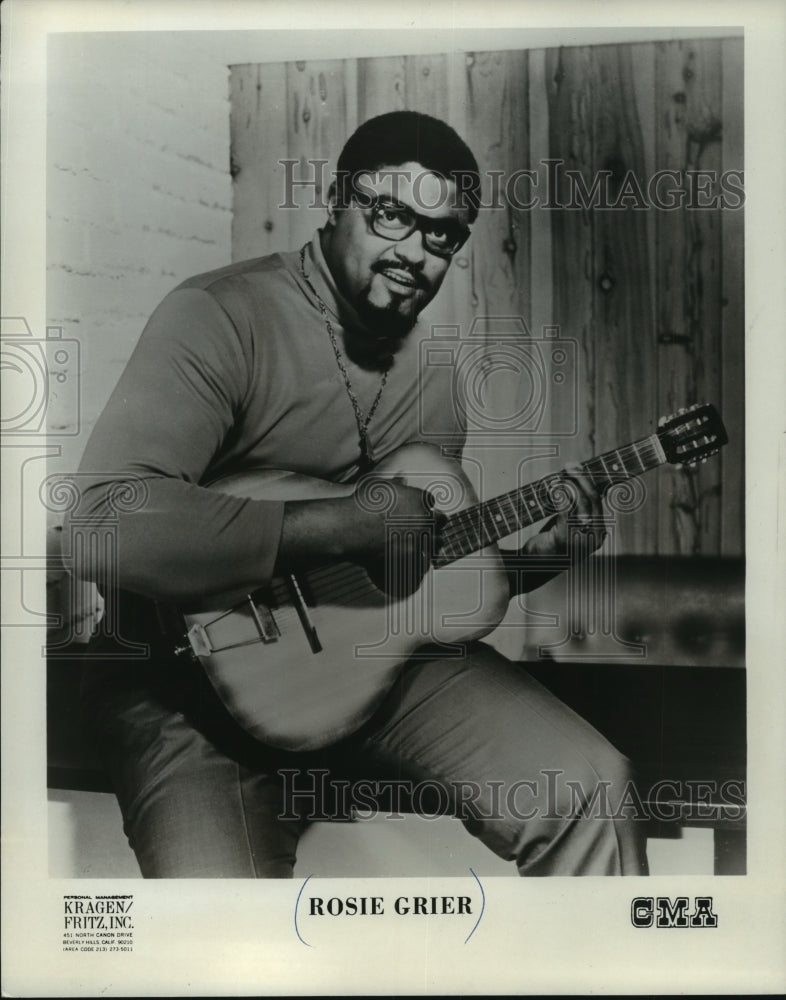 1969, Rosie Grier playing the guitar - mjp16264 - Historic Images