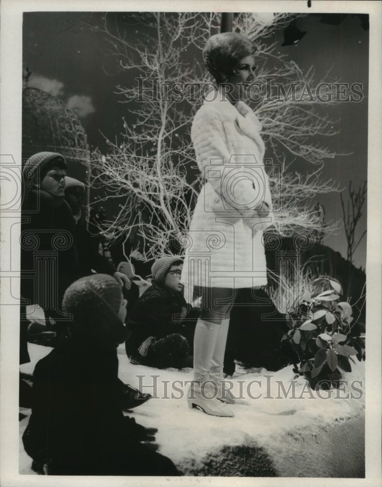 1967 Press Photo Mitzi Gaynor with children in snow scene - mjp16714 - Historic Images