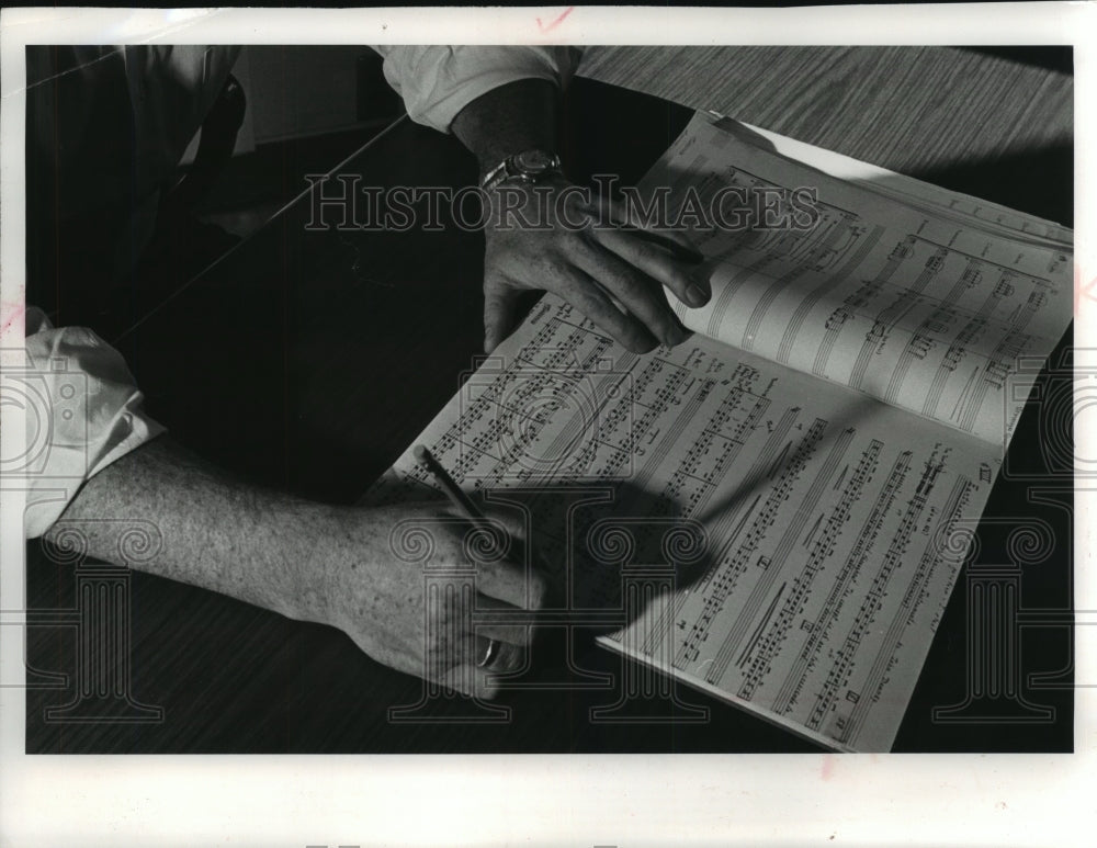 1968 Press Photo Composer John Downey checking one of his scores, Milwaukee- Historic Images
