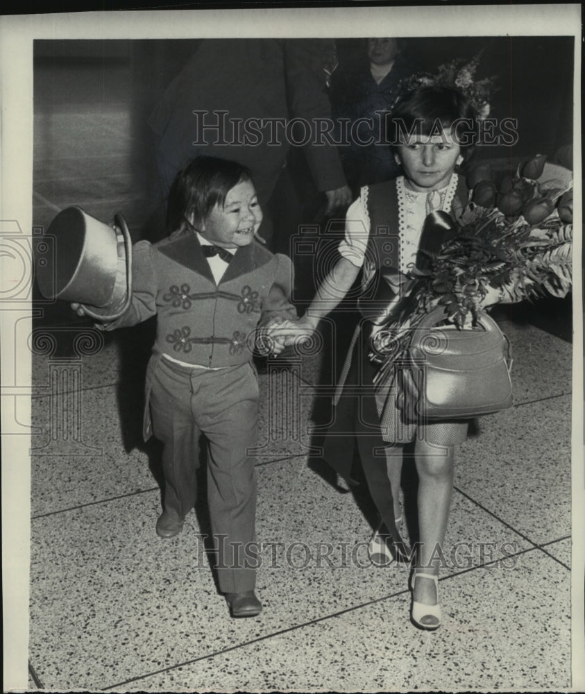 1975, Michu escorting his fiancee Juliana after announcement , N.Y. - Historic Images