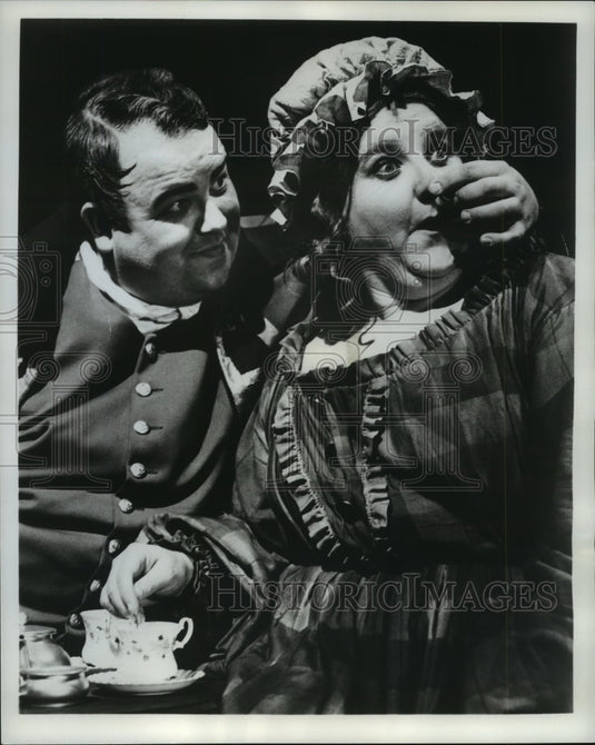 1965, Dale Malone & Lu Leonard sing a duet in a scene from "Oliver!" - Historic Images