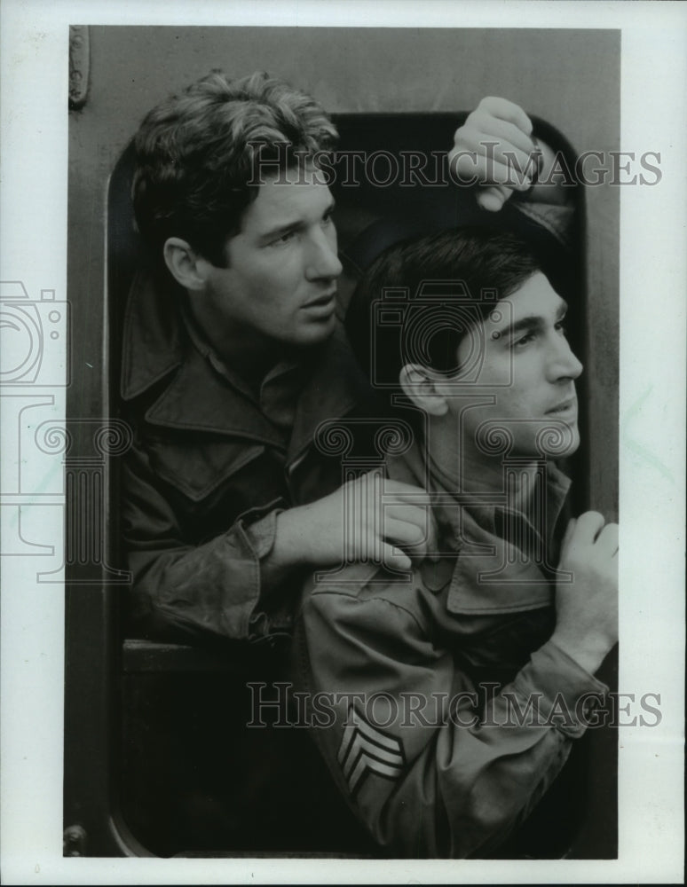 1983, Richard Gere and Chick Venners in "Yank's" aboard a train. - Historic Images