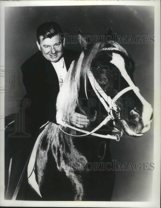 1972 Radio & TV star Arthur Godfrey riding his palomino horse - Historic Images