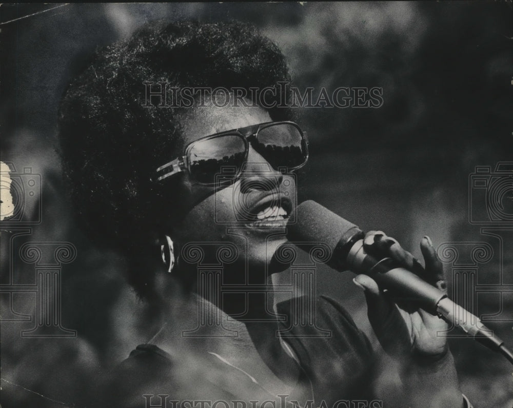 1975, Penny Goodwin sings at Washington Park - Historic Images