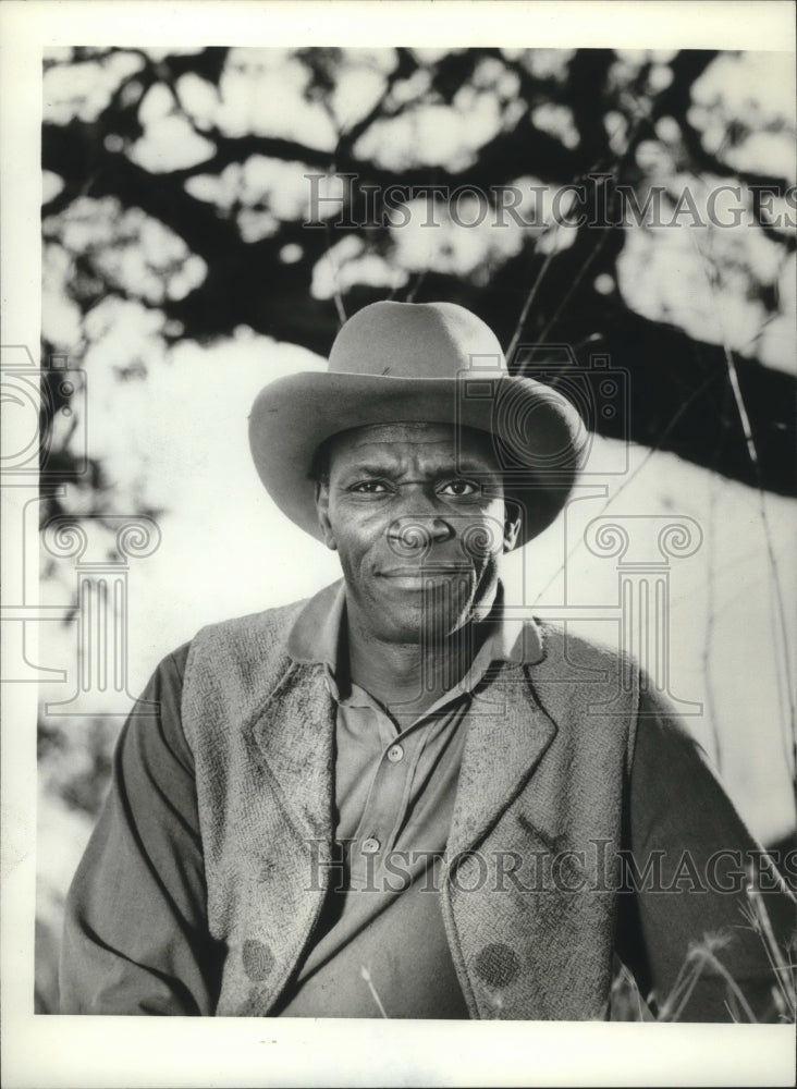 1974, Moses Gunn as Jebediah Nightlinger stars in &quot;The Cowboys&quot; - Historic Images