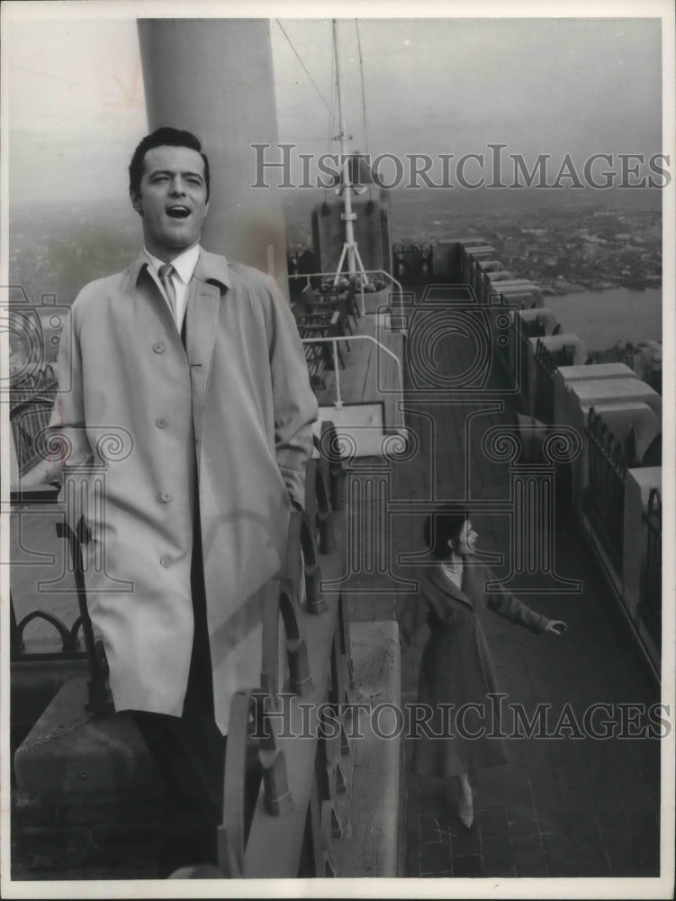 1962, Actor, Robert Goulet, in scene on to of New York RCA building - Historic Images