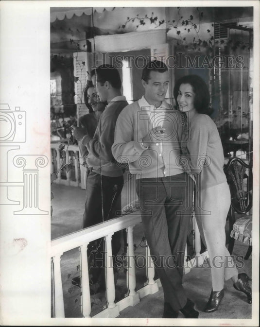 1964, Robert Goulet, wife, pose in living room - Historic Images