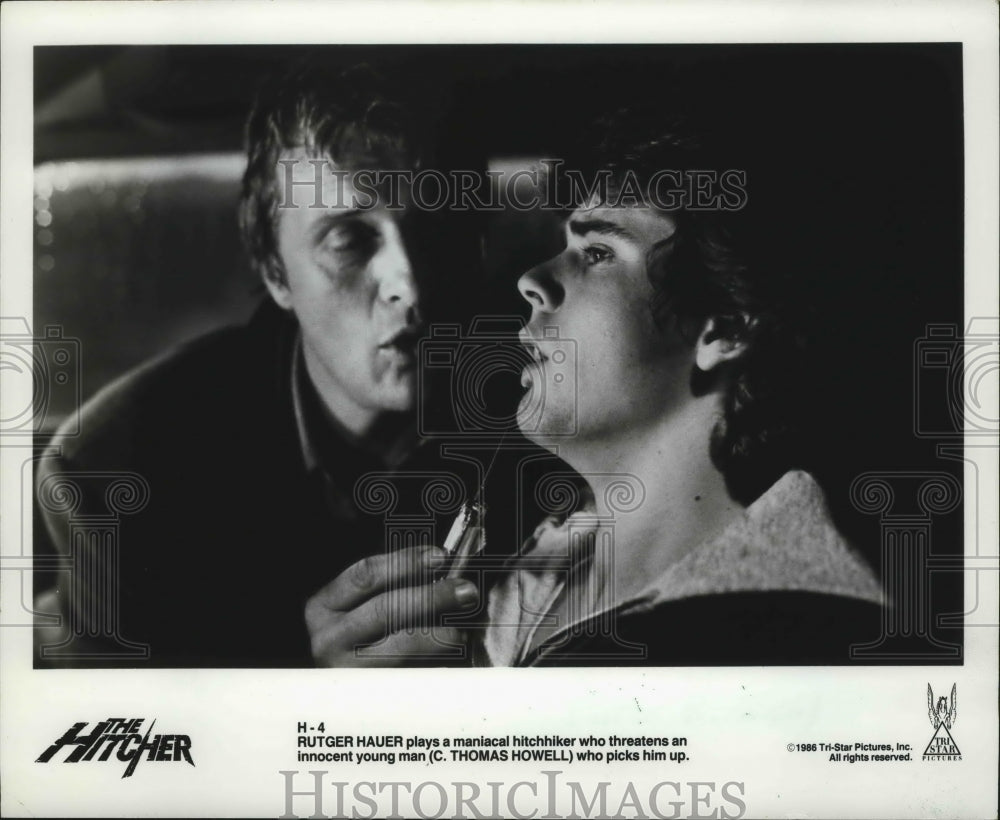 1986 Press Photo Rutger Hauer plays hitchhiker with C. Thomas Howell in movie-Historic Images