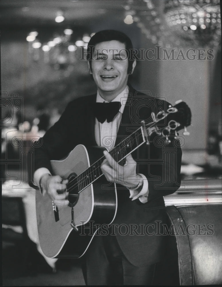 1970, Singer-guitarist Frankie Ray performs at Essex House Hotel. - Historic Images