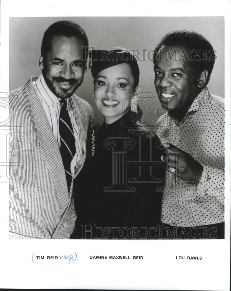 1988, Tim Reid and wife, Daphne Maxwell Reid with Lou Rawls. - Historic Images