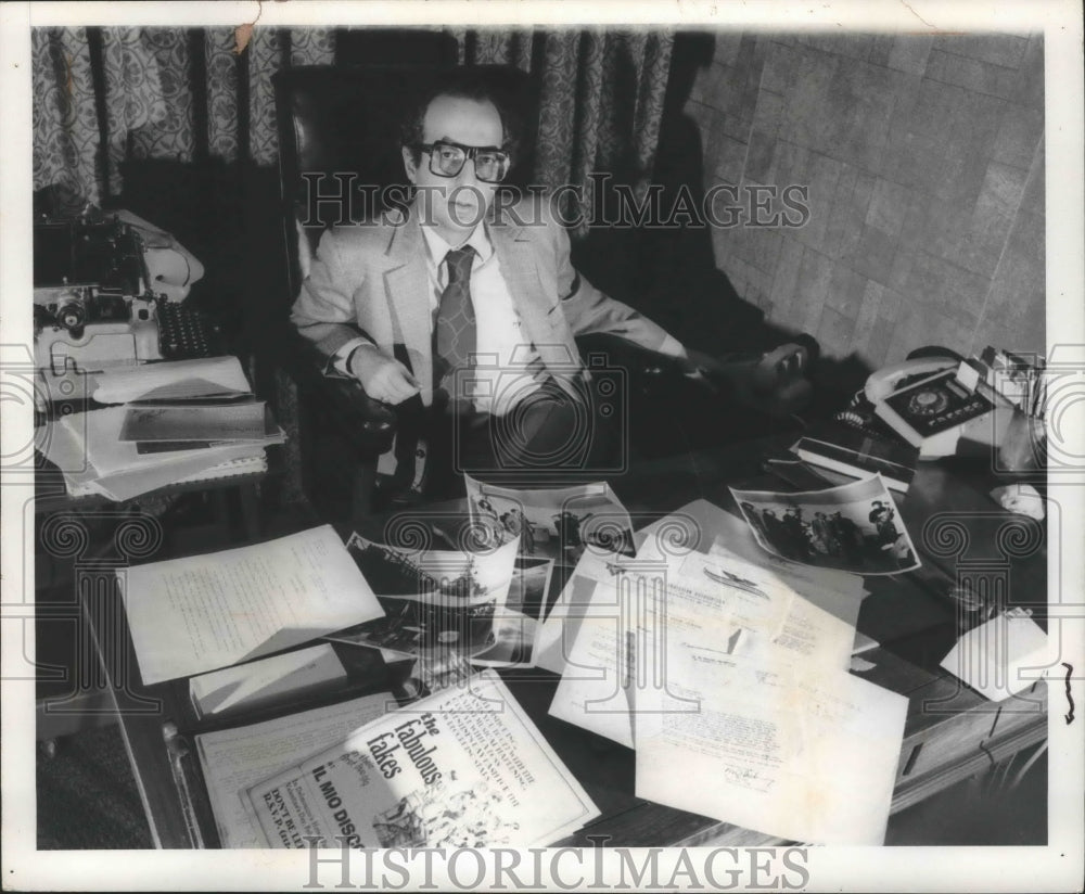 1971, Robert Perilla at his desk with memorabilia from his past - Historic Images