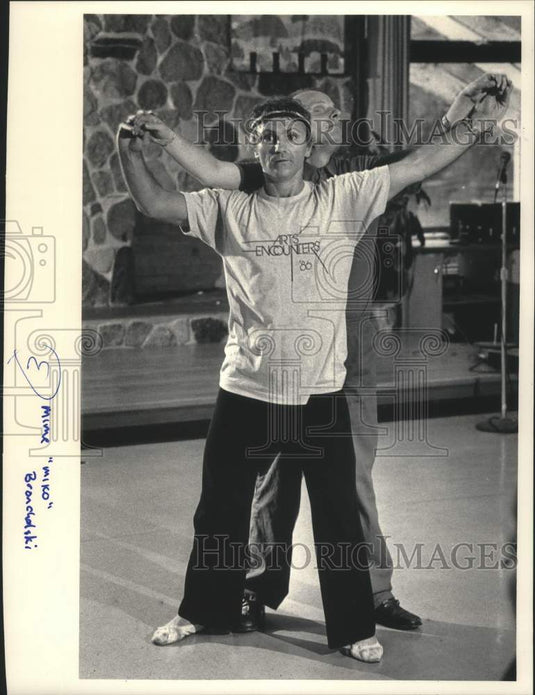 1986, Mime "Miko" Broncholski working with a blind man, Gary Bayer - Historic Images