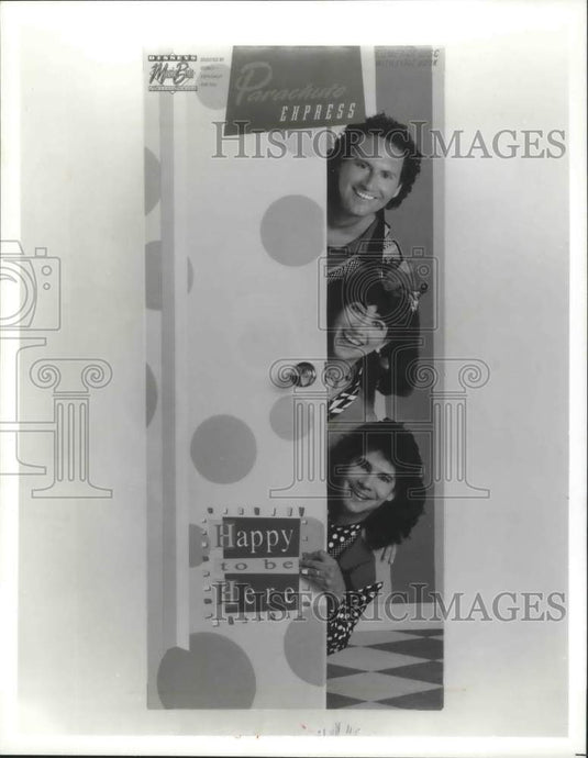 1992, Children's Music Group Parachute Express members poke heads out - Historic Images