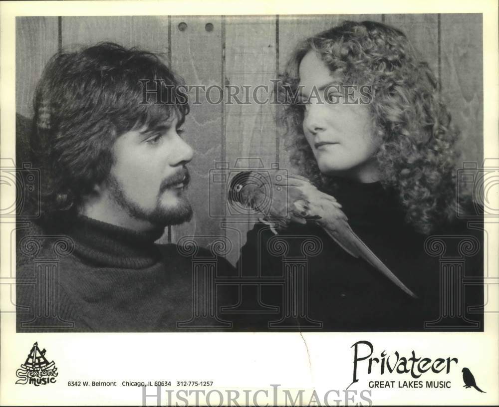 1991, Tom &amp; Christ Kastle of band &quot;Privateer&quot; pose with parrot - Historic Images