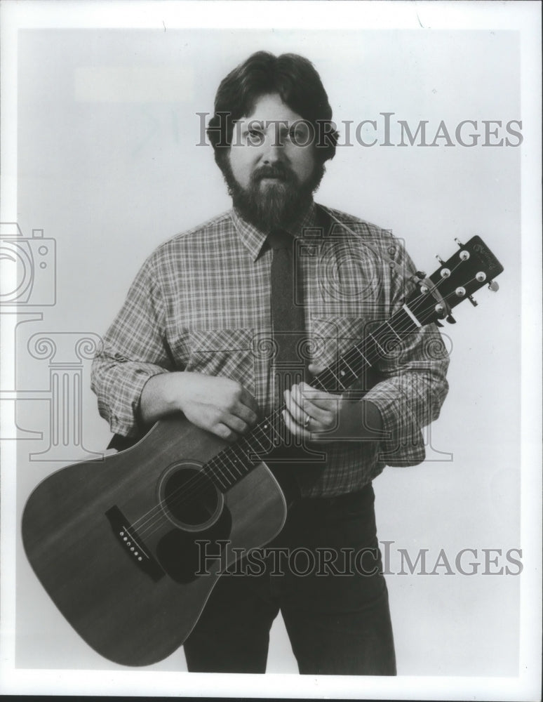 1986 Press Photo Lee Murdock folk music player with guitar, United States. - Historic Images