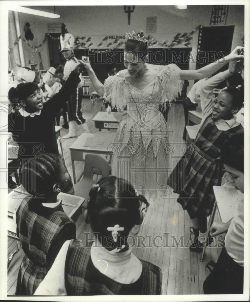 1990, Milwaukee Ballet Dancer Holds Students Hands At St. Rose School - Historic Images