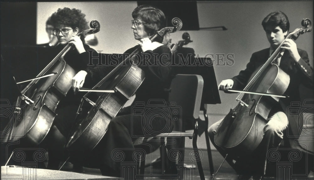 1988, Cello players performing during Ozaukee County concerto - Historic Images