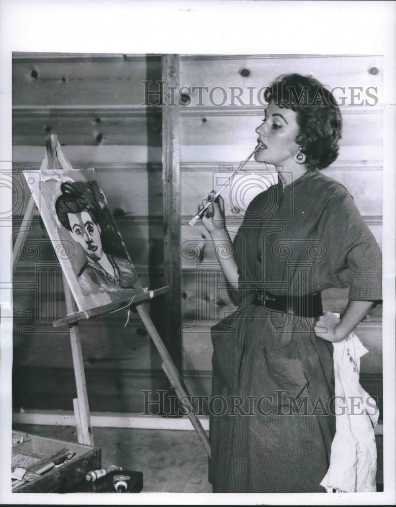 1955, Actress Dianne Foster paints in Hollywood home studio - Historic Images