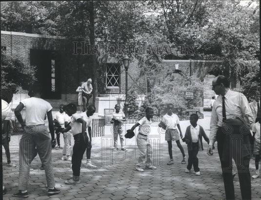 1966, Composer Henry Mancini Watches Game in Central Park in New York - Historic Images
