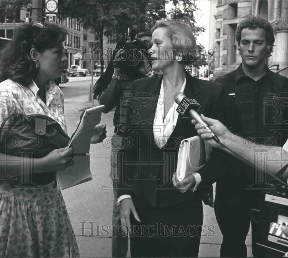 1990, Lynette Harris, former Playboy pinup being interviewed - Historic Images
