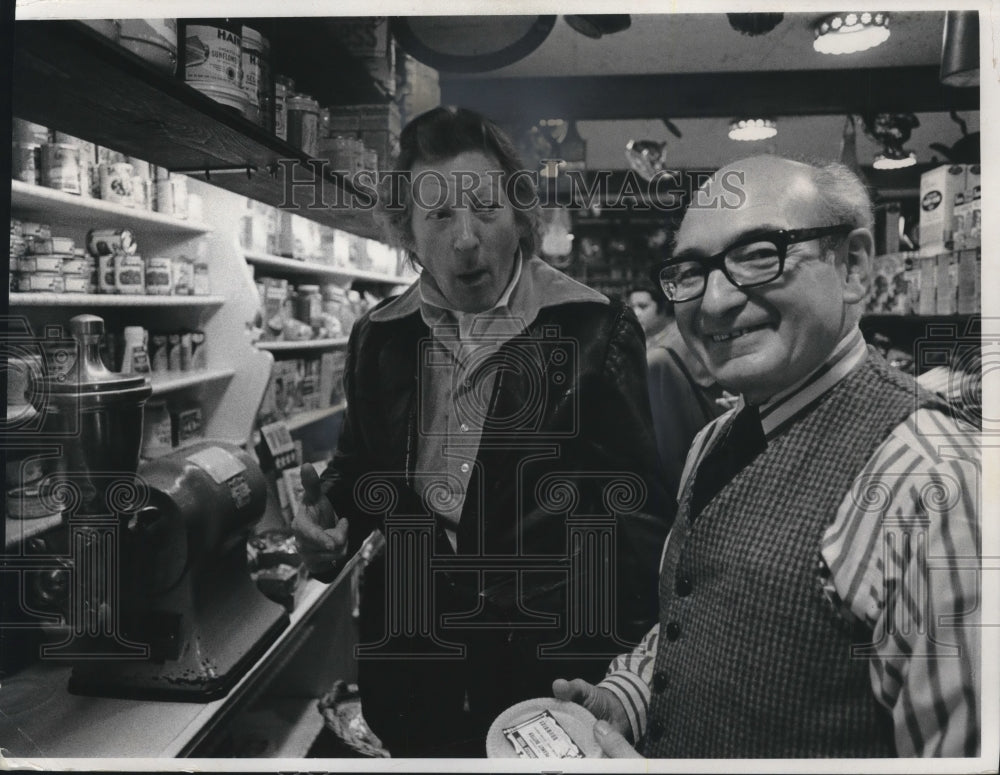 1970, Danny Kaye tastes fresh peanut butter at Sam Brown's food shop - Historic Images