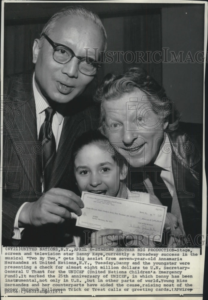 1971, Actor Danny Kaye presenting a check to U.N. Secretary General - Historic Images