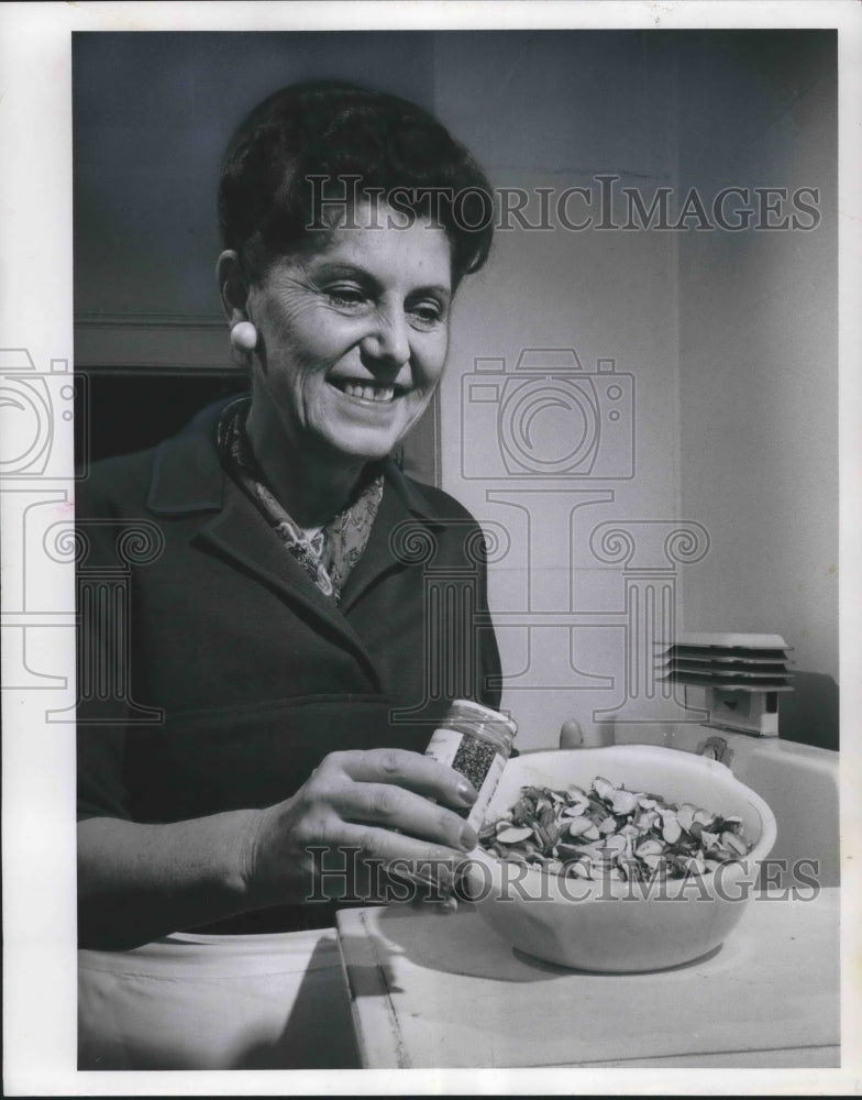 1963, Mrs. Dennis Morgan cooks casserole - Historic Images