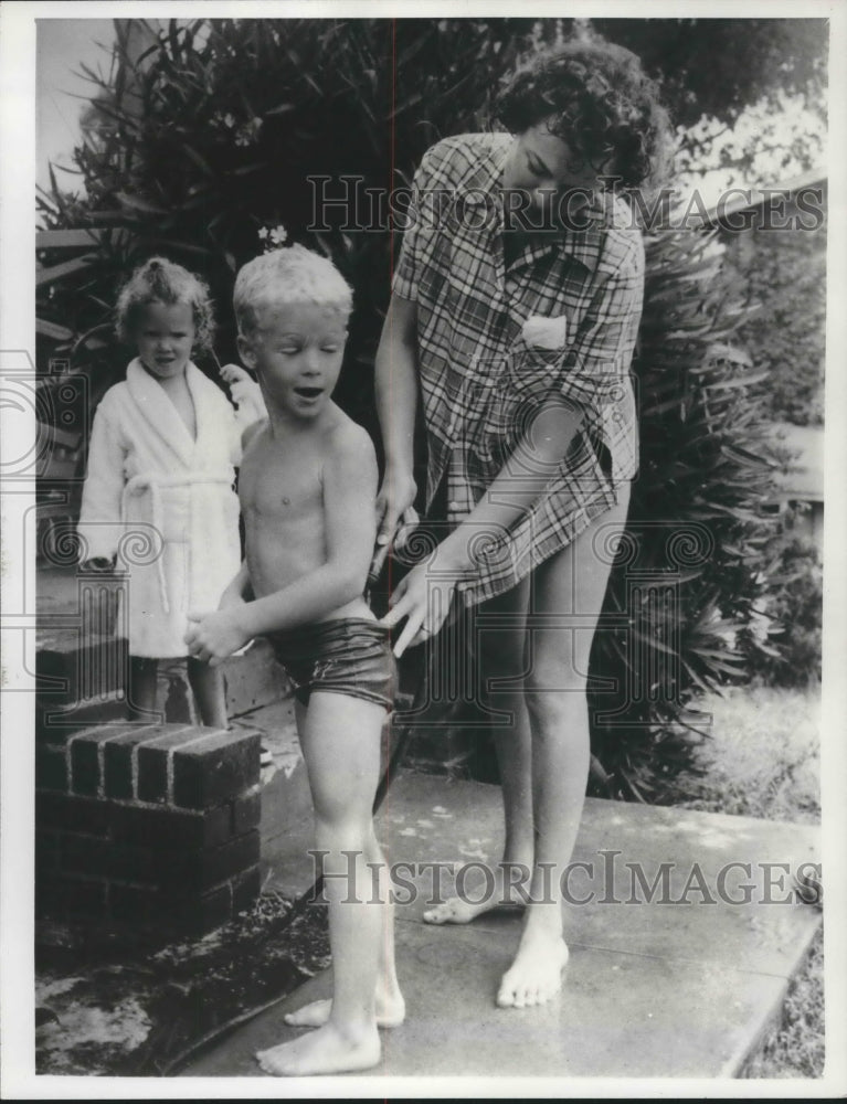 Press Photo Actor William Katt, here at age 6, gets help from his mother at home - Historic Images