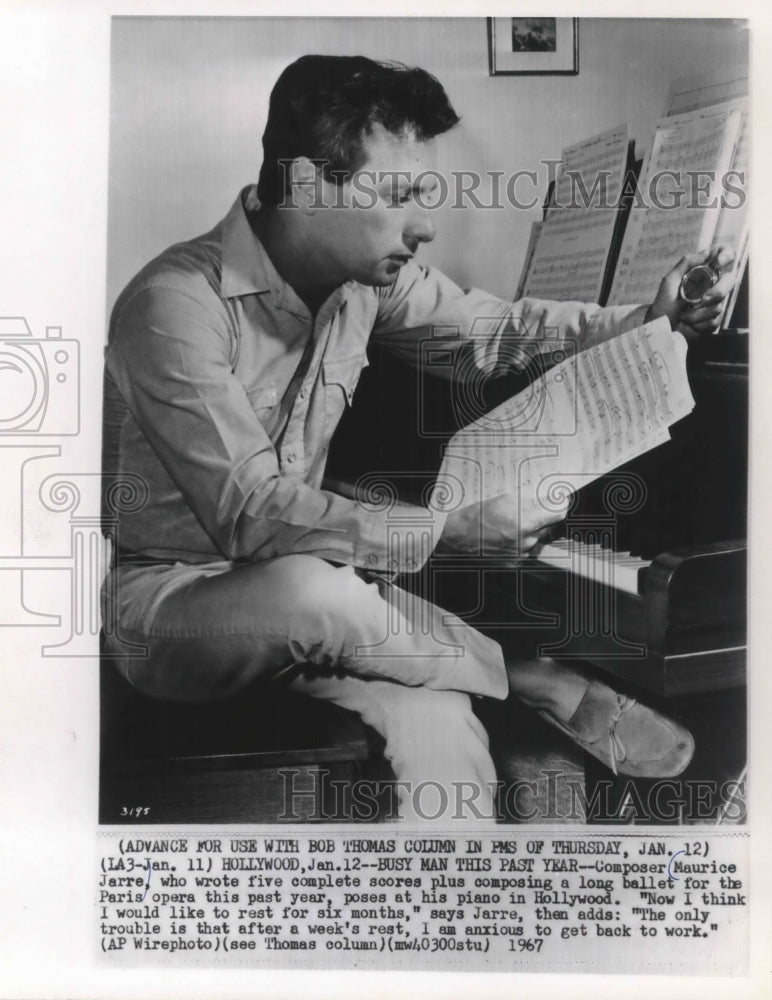 1967, Composer Maurice Jarre poses at his piano in Hollywood, CA - Historic Images