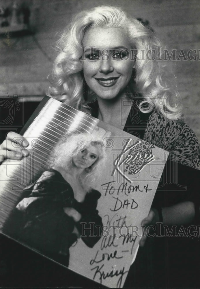 1991, Wisconsin Singer Kristine Rucinski holds a copy of her album - Historic Images